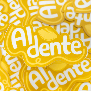 Stack of yellow 'Al dente' branded products with a clear background