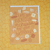 Card with cheese-themed design and text on a yellow patterned background