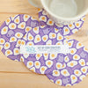 Set of four purple coasters with egg pattern on a wooden surface, featuring a label for '343 Design'.
