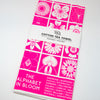 Cotton tea towel with pink floral pattern on a white background