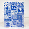 Blue and white patterned card with various designs on a white background