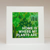 Green poster with plant-themed design and text 'Home is where my plants are' on a white background.