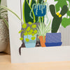 Illustration of a cat with plants on a white background