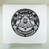 White tea towel with black and white design featuring text 'Rooted in Philadelphia' on a light green background
