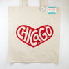 Beige tote bag with a red heart-shaped 'Chicago' design on a white background