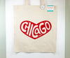 Beige tote bag with red heart-shaped 'Chicago' design on a white background