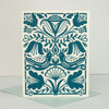 Decorative card with blue floral and leaf pattern on a beige background
