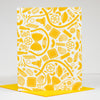 Yellow pasta pattern on a white card with a yellow envelope.