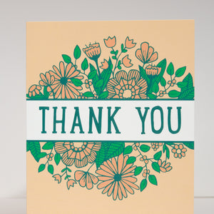 Card with floral design and 'Thank You' text on a beige background