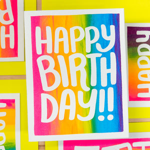 Colorful 'Happy Birthday' card on a yellow background