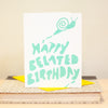simple belated birthday card featuring an illustration of a cute snail