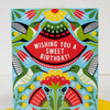 Colorful birthday card with birds and flowers on a white background