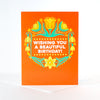 red birthday card featuring a bold tulip pattern
