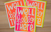 Three colorful greeting cards with 'Well hello there' text on a wooden surface