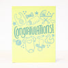 yellow baby shower card with pictures of different baby items
