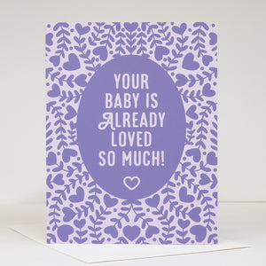 Greeting card with purple text 'Your baby is already loved so much!' on a heart-patterned background.