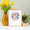 an art print featuring a circle of colorful birds flying about